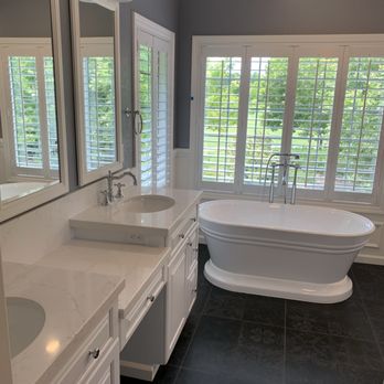 Bathroom remodel with double vanity and standalone tub